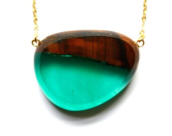 Large pebble shaped pendant / necklace handmade from Australian wood and green resin on a gold-plated chain
