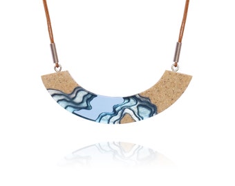 The Lagoon - Modern curved beach necklace handmade from beach sand and ultramarine blue resin on adjustable cord