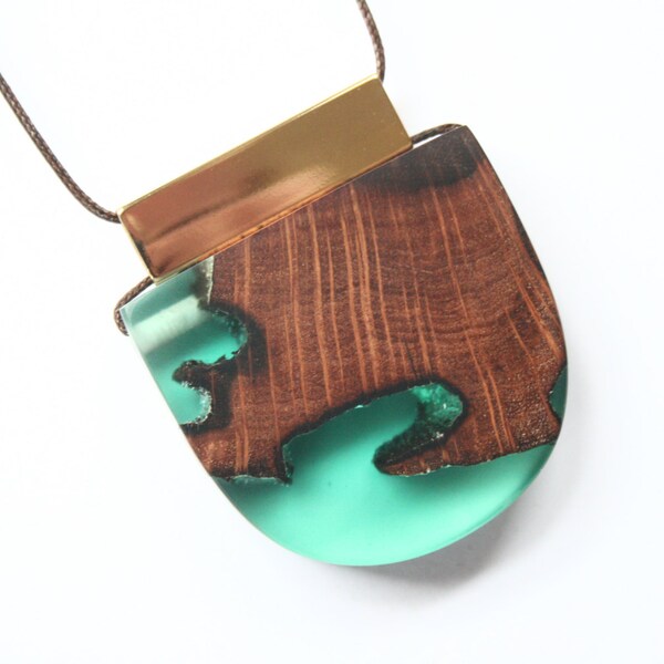 Huge pendant / necklace handmade from ancient Australian wood and green resin with a 16K gold-plated tube on dark brown waxed cord