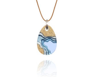 Cove pendant - teardrop shaped necklace handcrafted from beach sand and ultramarine blue resin on waxed caramel cotton cord