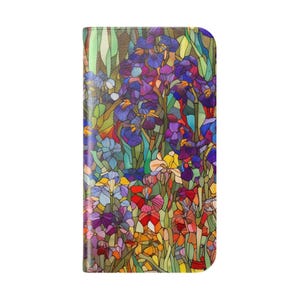 May include: A rectangular phone case featuring a vibrant stained glass pattern of purple, blue, yellow, and red irises with green foliage. The design consists of segmented, multi-colored shapes outlined in dark lines, creating a mosaic effect.