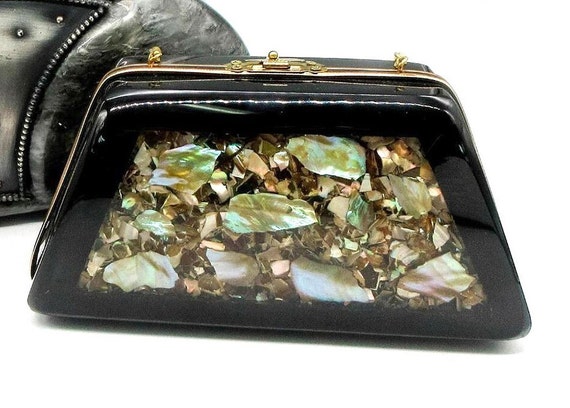 Black bag with gold shells on strap sale