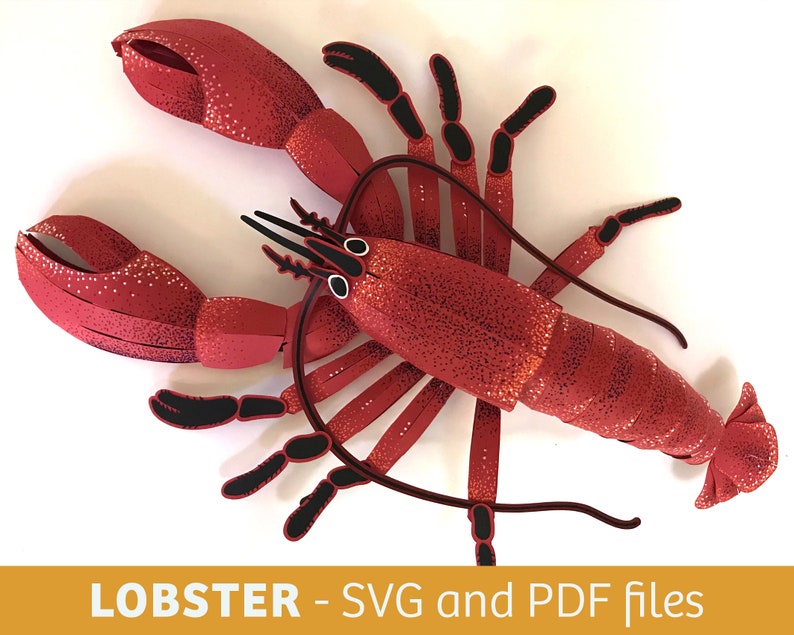 Peut inclure: Homard en papier rouge avec des d&eacute;tails noirs. Le homard est compos&eacute; de plusieurs morceaux de papier et est con&ccedil;u pour &ecirc;tre assembl&eacute;. L'image comprend le texte "LOBSTER - SVG and PDF files".