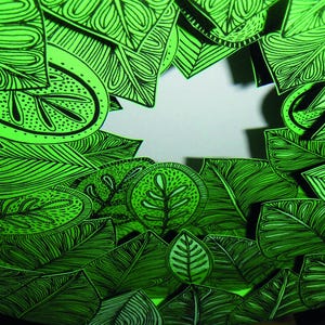 May include: A green and black patterned design with a white background in the center. The design is made up of leaves and other organic shapes.