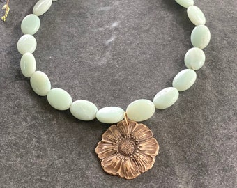 Handcrafted Bronze Sunflower on hand strung oval Aquamarine stones.