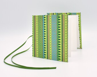 Handmade mini accordion album with a green and aqua stripe pattern
