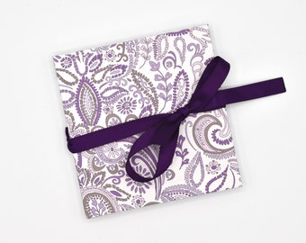 Handmade mini accordion album with purple paisley pattern on white