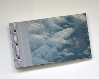 Handmade photo album with textured gray and silver cover
