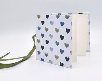 Handmade mini accordion album with blue and olive green hearts