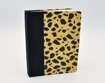 Handmade blank travel journal with leopard print on cover
