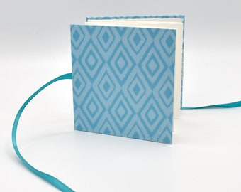 Handmade mini accordion album with blue diamonds