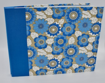 Handmade expandable scrapbook with large blue flowers