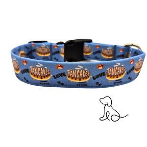 May include: Blue dog collar with a repeating pattern of pancakes and the text "Love Pancakes Short Stack".