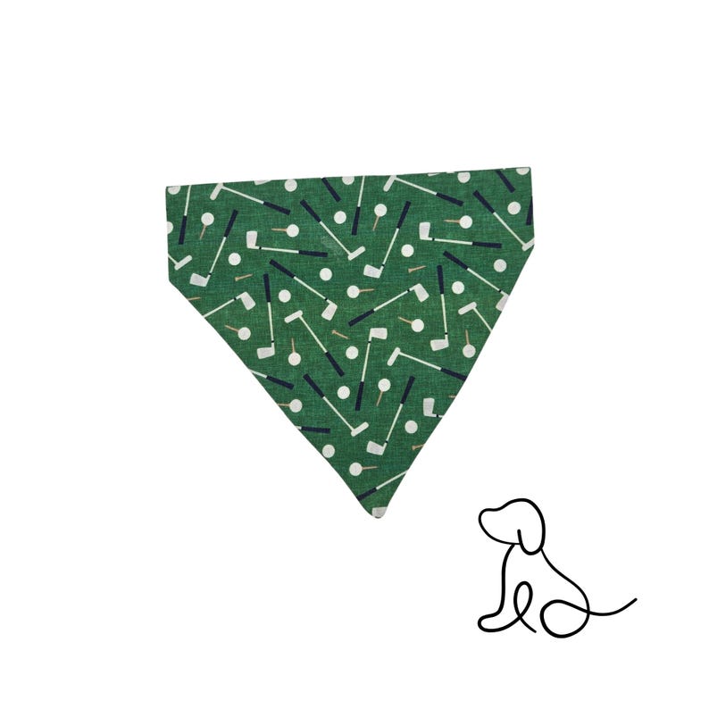 May include: Green dog bandana with a golf-themed pattern. The bandana features a repeating design of golf clubs, golf balls, and tees in white, black, and tan. A simple line drawing of a dog is in the lower right corner.