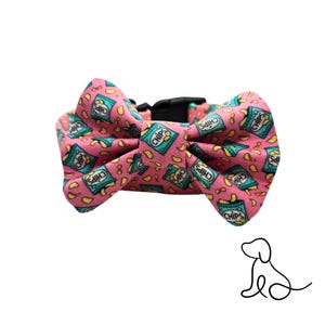 May include: Pink dog bow tie with a pattern of blue and yellow chip bags that say "Chips" on them.