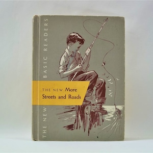 May include: A vintage book cover with a yellow and white title bar that reads "The New More Streets and Roads". The cover features a drawing of a boy fishing from a pier with a fishing rod and line. The book is part of the "Basic Readers" series.