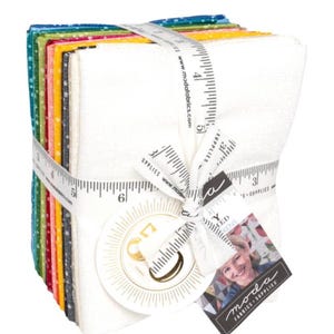 May include: A stack of colorful fabric squares, bound with a white ribbon printed with measurements. The fabric bundle includes various colors and patterns, with a white fabric square on the front. A tag with the text "moda FABRICS + SUPPLIES" is attached.