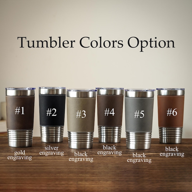 May include: Image shows six insulated tumblers with silver rims and bases, each with a different colored leather sleeve. The text "Tumbler Colors Option" is at the top. Each tumbler is numbered and has a different engraving color option.