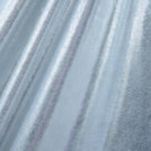 May include: White sheer fabric with a subtle shimmer. The fabric has a delicate texture and a soft, flowing drape.