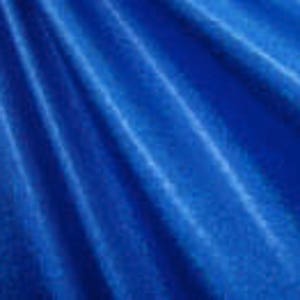 May include: A vibrant blue fabric with a subtle, textured pattern. The fabric has a soft, smooth feel and is perfect for crafting projects.