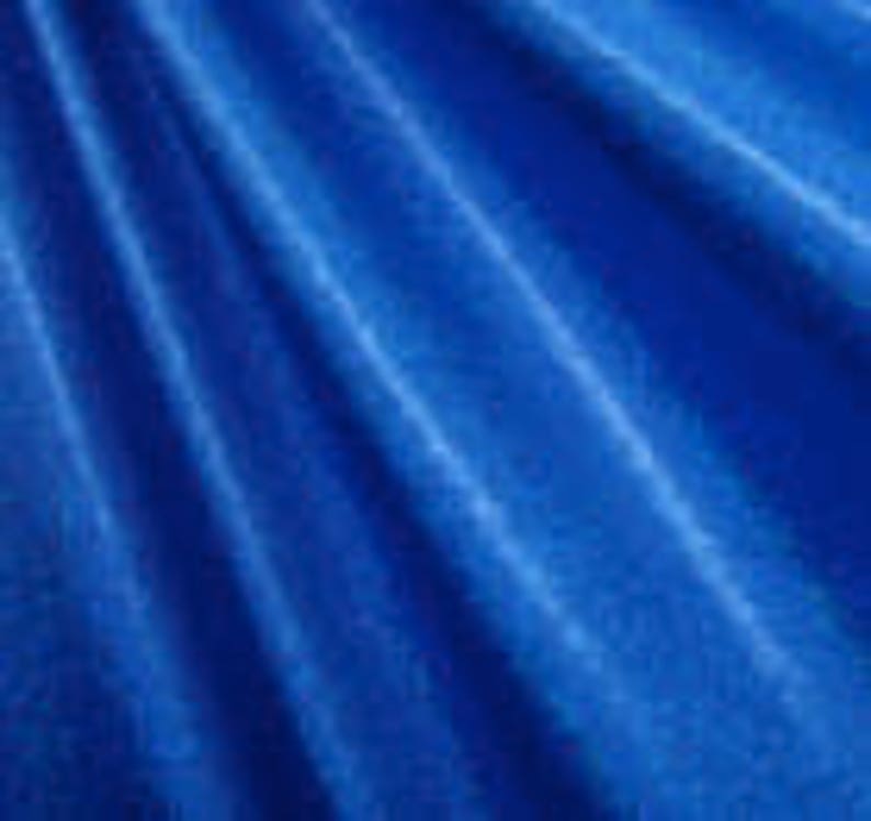 May include: A vibrant blue fabric with a subtle, textured pattern. The fabric has a soft, smooth feel and is perfect for crafting projects.