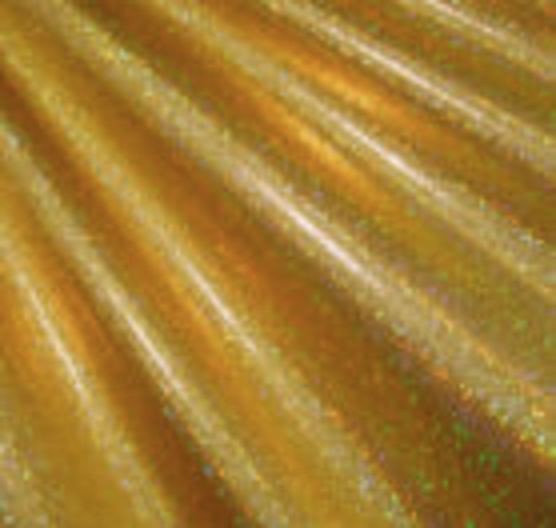 May include: Gold iridescent fabric with a subtle shimmer. The fabric has a smooth, silky texture.