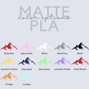 May include: A color chart titled MATTE color options PLA displaying twelve mountain icons in various colors: Ruby Red, Sakura Pink, White, Slate Gray, Black, Sunshine Yellow, Navy Blue, Mint Green, Lavender Purple, Earth Brown, Orange, and Ice Blue.