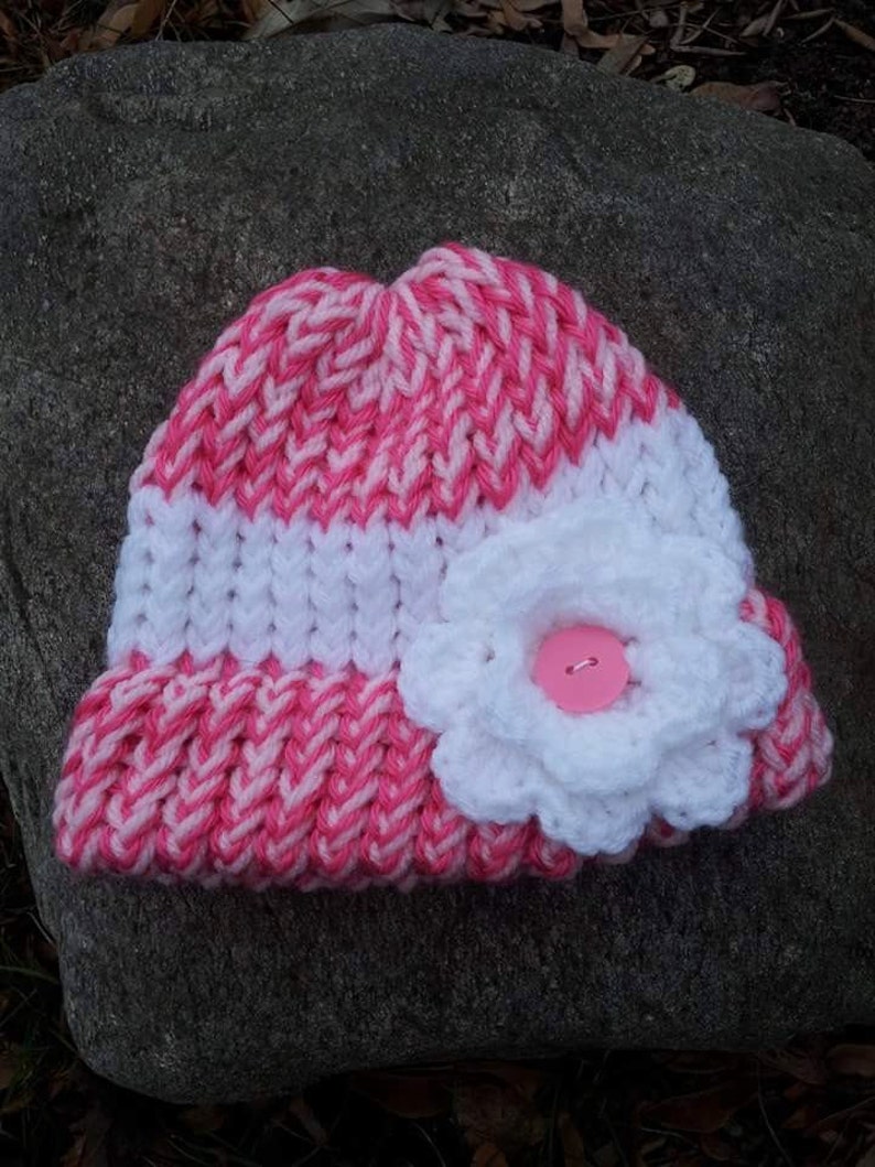white knitted baby hat