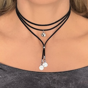 May include: A rustic wooden sign with the text "Welcome to our home" in white lettering. The sign features a distressed finish and a simple, inviting design, perfect for front door decor.