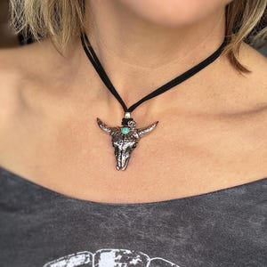 Stainless Steel Cow skull pendant necklace with turquoise accent on faux leather cord. Boho Ranch Style necklace for women and cowgirls