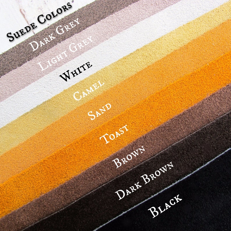 May include: A suede colour chart with 10 different colours: dark grey, light grey, white, camel, sand, toast, brown, dark brown, and black. The chart is labelled "Suede Colors".