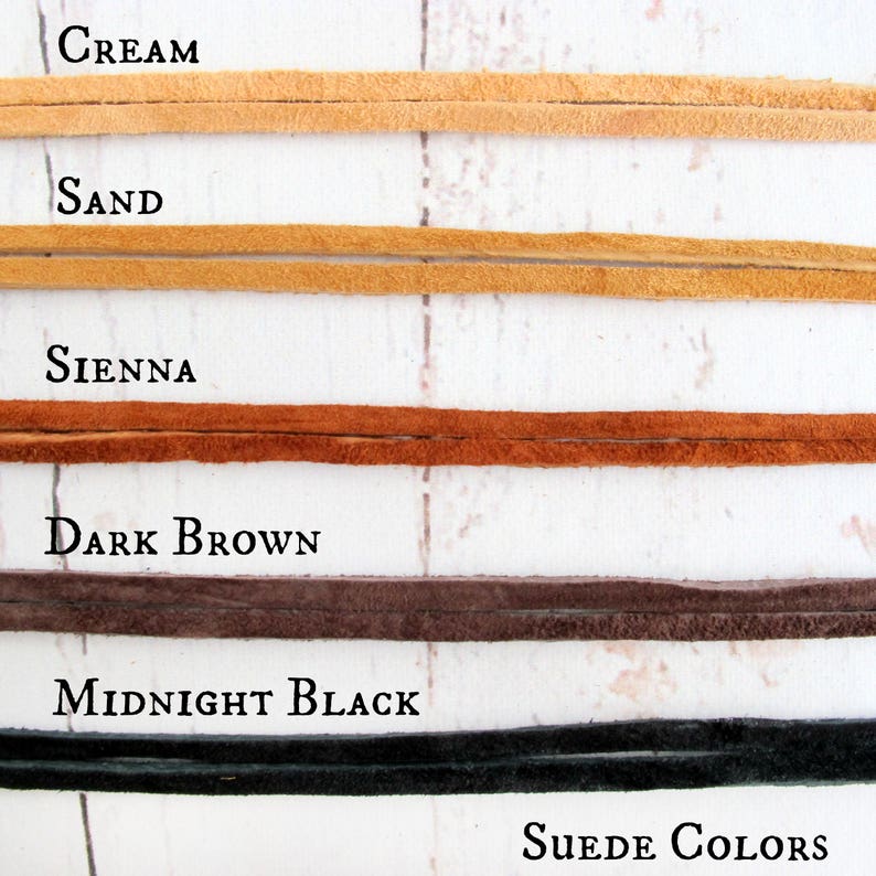 May include: Five suede leather cords in different colors: cream, sand, sienna, dark brown, and midnight black. The text "SUEDE COLORS" is at the bottom of the image.