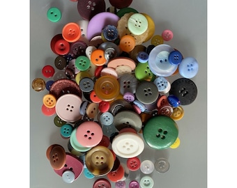 May include: A large collection of colorful buttons in various shapes and sizes. The buttons are made of plastic, metal, and wood. Some buttons have a floral design, while others have a geometric design.