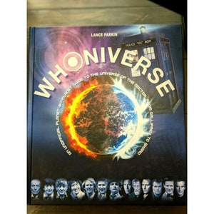 May include: A book titled "WhoUniverse: An Unofficial Planet-by-Planet Guide to the Universe of the Doctor, from Gallifrey to Skaro" by Lance Parkin. The cover features a blue and red planet with flames and a blue police box.