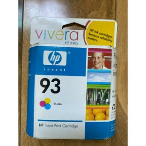 May include: A blue and white HP ink cartridge package with the number 93 printed in large font. The package says "HP Inkjet Print Cartridge" and "Tri-color". The HP logo is visible on the package.