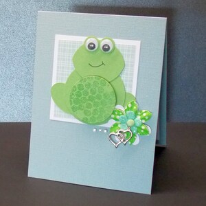Carte de grenouille de la fête des Mères avec des fleurs- Hoppy Mother’s Day- Carte de vœux faite à la main