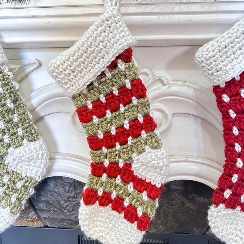 Chunky crochet Christmas stocking made with super bulky yarn for a cozy farmhouse holiday look. Features thick textured stitches and a wide hanging loop for easy display on mantels or stair rails. Shown in neutral tones for rustic, modern Christmas decor. Quick and easy PDF crochet pattern perfect for beginners and experienced makers. A timeless handmade stocking for festive home décor or thoughtful holiday gifting.