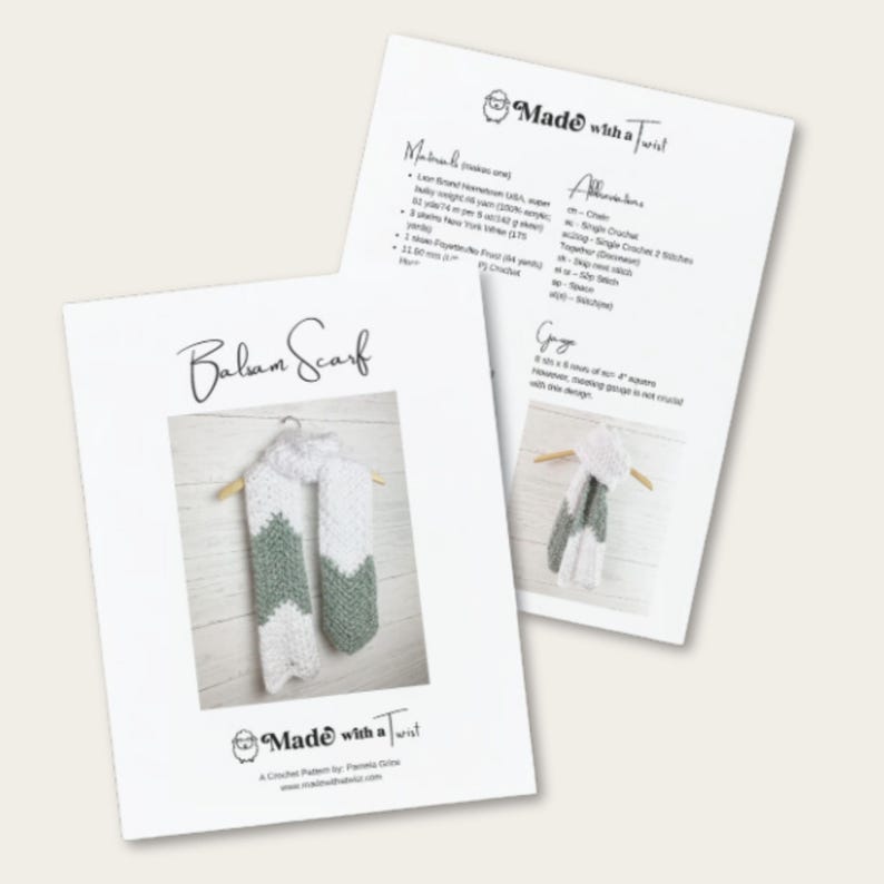 May include: Two white papers with text and a crochet scarf pattern. The pattern is for a "Balsam Scarf" with a white and green chevron design. The papers also include the text "Made with a Twist" and crochet abbreviations.