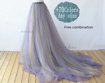 Puede incluir: Una falda larga y fluida de tul en tonos lavanda y crema. La falda se muestra en un maniquí y tiene una cintura. El texto '+70Colors Any size Free combination' es visible en la imagen.