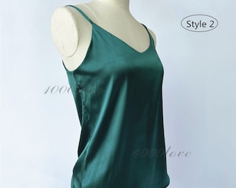 May include: A dark green satin tank top with a v-neck and thin straps. The top is on a white mannequin. The text "Style 2" is in the upper right corner of the image. The text "Color NO. 16# Dark green" is in the lower left corner of the image.