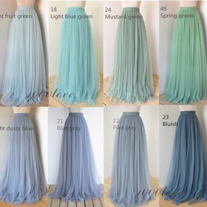 May include: A set of ten tulle skirts in various shades of blue and green. The skirts are all full-length and have a high waist. The colors include light fruit green, light blue green, mustard green, spring green, light dusty blue, blue gray, pike gray, and bluish.