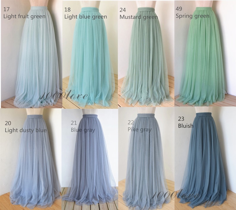 May include: A set of ten tulle skirts in various shades of blue and green. The skirts are all full-length and have a high waist. The colors include light fruit green, light blue green, mustard green, spring green, light dusty blue, blue gray, pike gray, and bluish.
