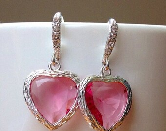 Silver framed pink faceted heart crystals on crystal studded silver fancy earwires