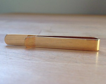 Gold tie bar