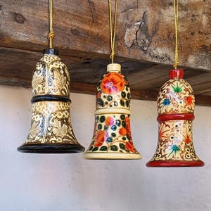 Hand-painted papier-mâché bells for the Christmas tree. Chrismas tree hand made decorations.