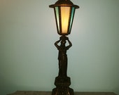 Old large figural gilt metal spelter lamp with neoclassical maiden cherubs marble base slag glass panels circa 1930s