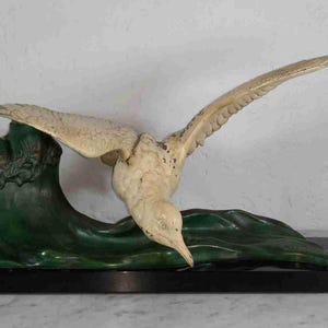 Large Art Deco French animalist white seagull flying over sea wave on marble base by LORIOT 1920s