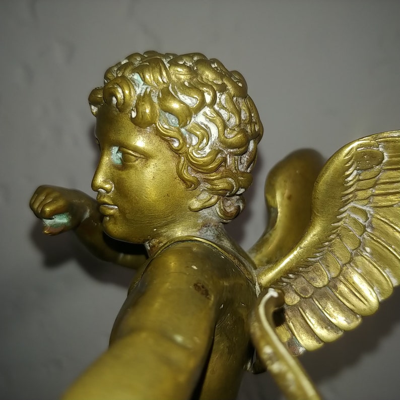 Antique French neoclassical gilt bronze sculpture of cupid angel on wood base circa 1880s