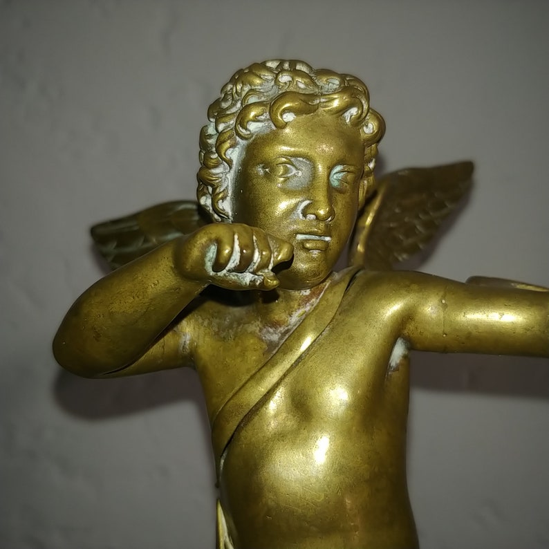 Antique French neoclassical gilt bronze sculpture of cupid angel on wood base circa 1880s