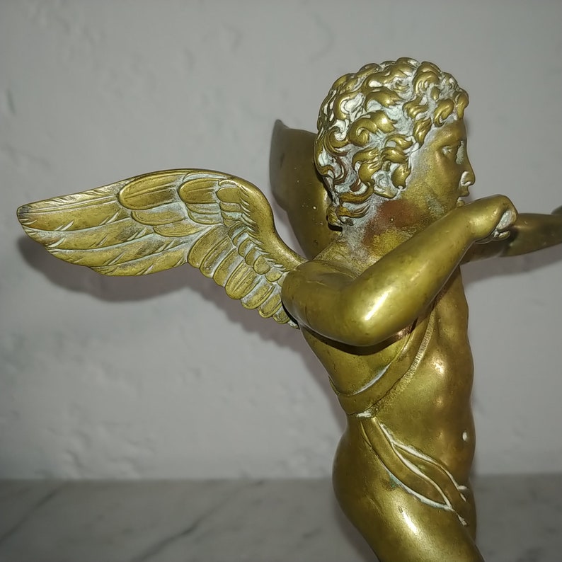Antique French neoclassical gilt bronze sculpture of cupid angel on wood base circa 1880s